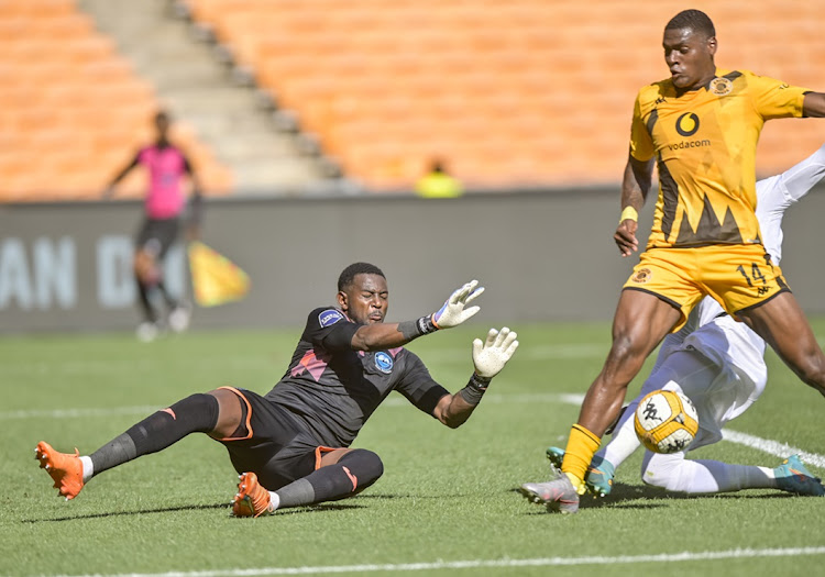 Jasond González of Kaizer Chiefs is thwarted by the challenge of Richards Bay defender Lucky Mohomi while goalkeeper Salim Magoola covers in the DStv Premiership match at FNB Stadium on Saturday.