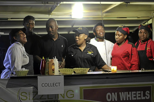 Hospitality entrepreneur Keneilwe Modisane, middle, is the founder of Sizzling Catering and Events Management. Next to her is her husband Tshepo Modisane, left, and some of her employees.