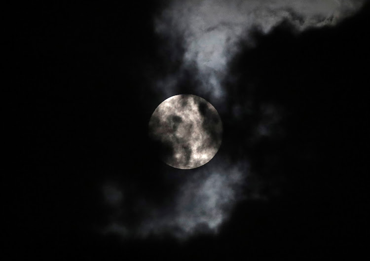 The Pink Supermoon is seen over the City, during an astronomical event that occurs when the moon is closest to the Earth in its orbit, making it appear much larger and brighter than usual, as the spread of the coronavirus disease (COVID-19) continues in Mexico City, Mexico, April 7 2020.