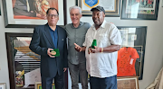 Safa president Danny Jordaan (left) and former Bafana Bafana coach Jomo Sono (right) display their Africa Cup of Nations bronze medals, flanking Bafana coach Hugo Broos as Safa House in Nasrec.