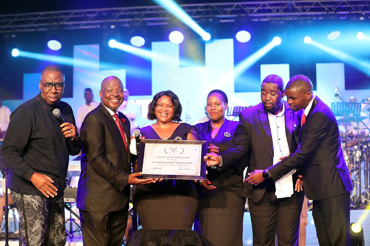 Ncandweni Christ Ambassadors receiving a certificate of appreciation for their contribution to gospel music in South Africa and beyond.