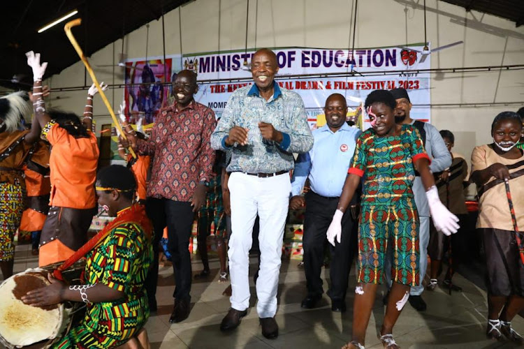 Education CS Ezekiel Machogu and Basic Education PS Belio Kipsang join Santa Maria Secondary School students performing a creative cultural dance at the National Drama Festivals in Mombasa on April 28, 2023.