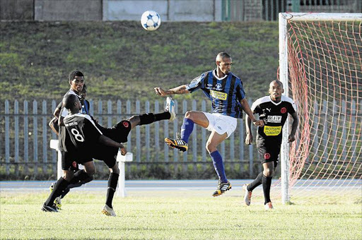 BALL BATTLE: FC Buffalo and Lion City players in action during a league match. Picture: SIBONGILE NGALWA