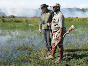 Lead field guide Mandla Buthelezi from the Wilderness Leadership School and iSimangaliso Wetland Park chief executive Andrew Zaloumis out walking on the shores of Lake St Lucia.