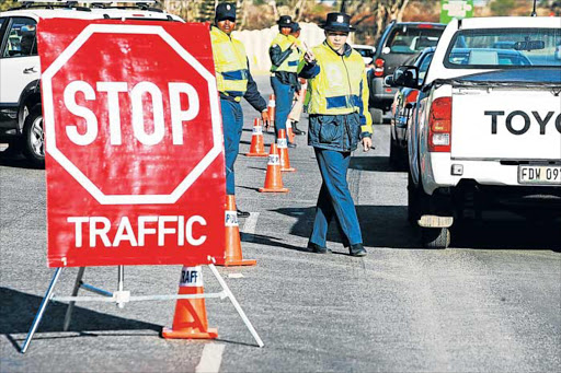 UNEXPECTED: BCM traffic and law enforcement officers, who angered residents of Gonubie with their early morning blitz to recover unpaid fines. The metro plans to establish its own courts Picture: THEO JEPTHA