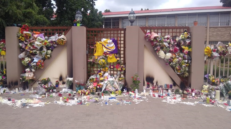 Flowers and messages have been left at Hoërskool Driehoek where four pupils died last week.