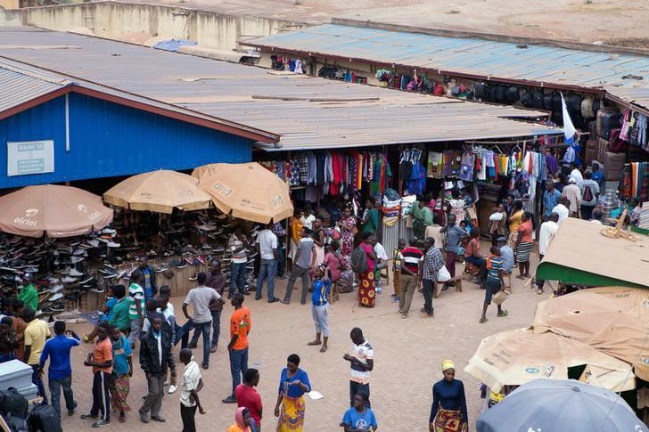 People are seen looking at clothing items in the Nyabugogo Market in Kigali, Rwanda July 31, 2018.