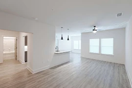 Open concept floorplan with wood finish flooring throughout