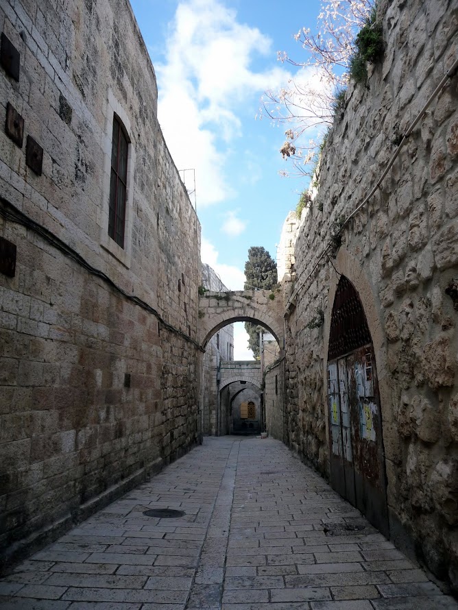 Travel to Israel - Jerusalem. Walking through the Armenian Quarter, one of the four neighborhoods comprising the Old City. You can't see most of it, just this one street alongside its walls