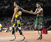 Oscar Pistorius congratulates Brazil's Alan Oliveira, who won the men's 200m T44 classification at the Paralympic Games in London. Pistorius contends he was at a disadvantage, but evidence does not back this up