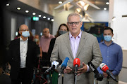 Australian Prime Minister Scott Morrison speaks to media during a visit to Castle Hill Medical Centre to preview the COVID-19 vaccination program, in Sydney, Australia February 21, 2021.   