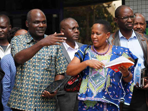 IEBC chairman Wafula Chebukati with Judy Pareno of ODM and Andrew Musangi of Jubilee Party after a consultative meeting on monitoring and regulation of the party primaries at Anniversary Towers yesterday /JACK OWUOR