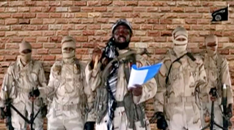 Boko Haram leader Abubakar Shekau speaks in front of guards in an unknown location in Nigeria in this still image taken from an undated video obtained on January 15, 2018.