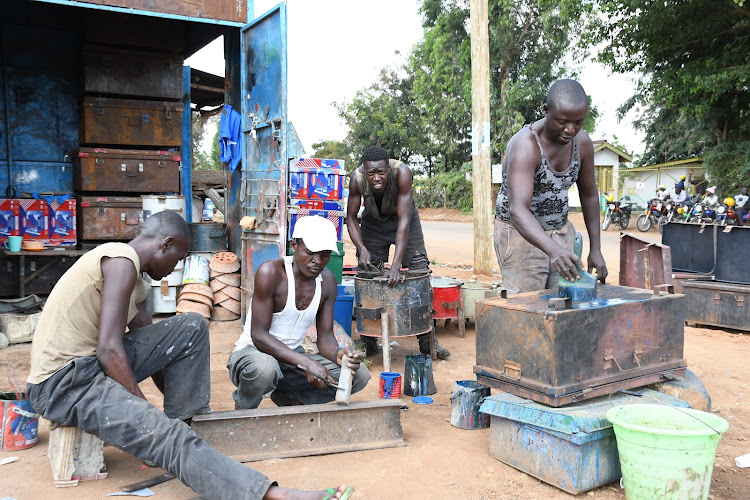 Scrap metal dealers at at their work station along the Malaba-Busia road on September 13, 2022.