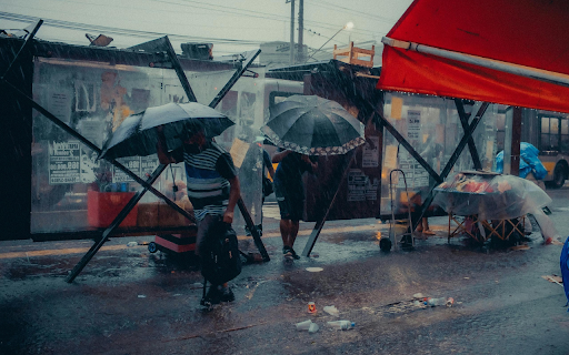 Umbrellas Walking on a Sidewalk in City in Heavy Rain screenshot 1