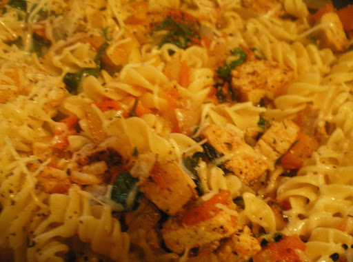 Homemade Chicken and Apple Smoked Sausages with pasta, spinach, peppers, onion, and garlic