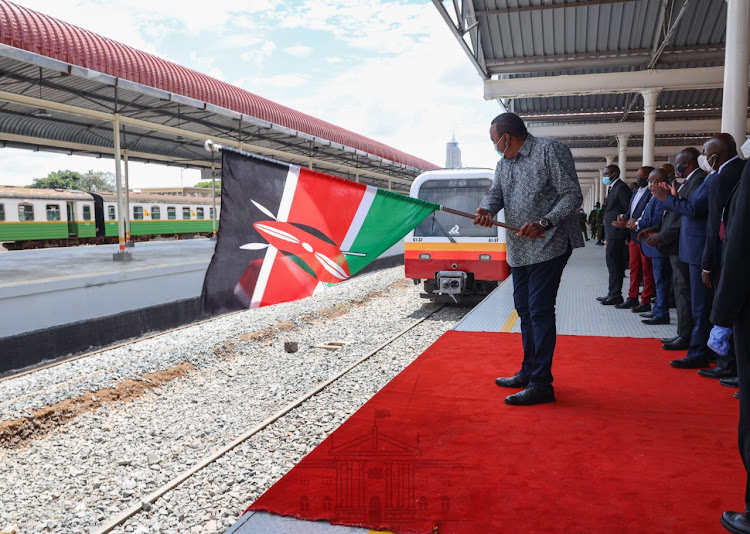 President Uhuru Kenyatta flags off the Diesel Multiple Units shortly after unveiling the refurbished Nairobi Central Railway Station. The Station was reconstructed as part of the ongoing modernisation programme of the Nairobi Commuter Railway Service