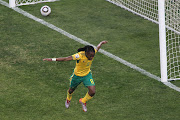  Siphiwe Tshabalala of South Africa celebrates scoring the first goal during the 2010 FIFA World Cup South Africa Group A match between South Africa and Mexico at Soccer City Stadium on June 11, 2010 in Johannesburg, South Africa. 