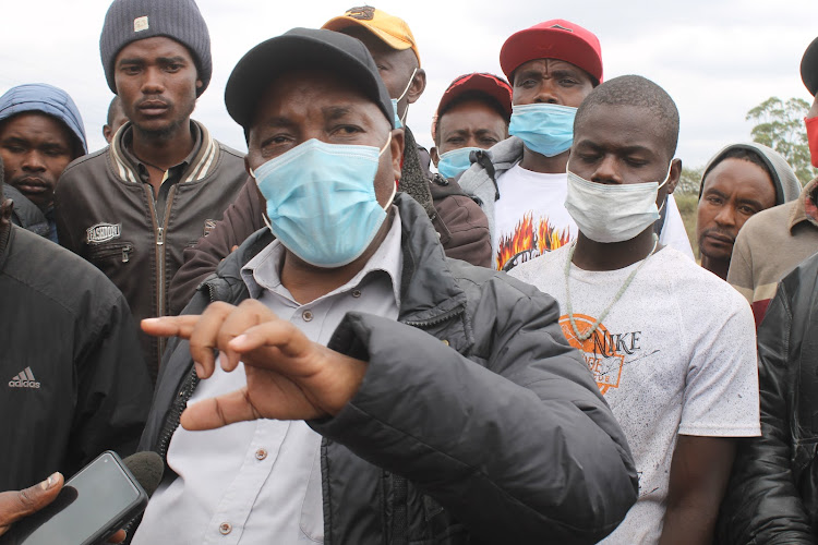 Machakos Squatters Upgrading Association chairman Alphonse Isiula at the disputed East African Portland Cement land in Athi River, Machakos county on Wednesday, July 21.