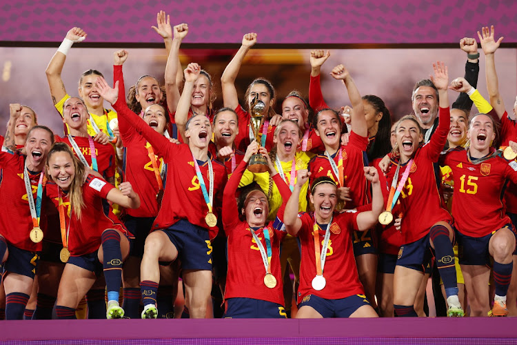 Ivana Andres of Spain and her teammates celebrate with the Fifa Women's World Cup trophy after their victory final against England at Stadium Australia in Sydney on Sunday.