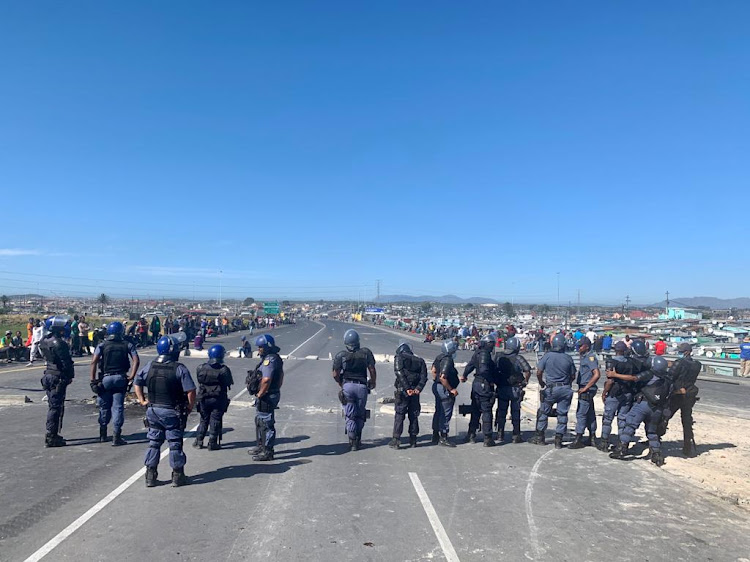 Police on Mew Way, Khayelitsha.