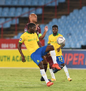 Aubrey Modiba of Mamelodi Sundowns challenges Robyn Johannes of Stellenbosch FC.