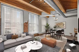 Modern apartment interior with exposed beams, large windows, sectional sofa, dining area, and stylish decor.