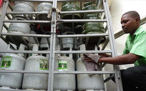 Samuel Mose arranges gas at National fuelling station Mombasa, the commodity’s demand is high as the supply is limited thus increasing the price Jan 18 2012.Photo/Elkana Jacob