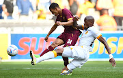 Devin Titus of Stellenbosch FC is challenged by Kaizer Chiefs' Sfiso Hlanti in the DStv Premiership match at Cape Town Stadium on October 9 2022.