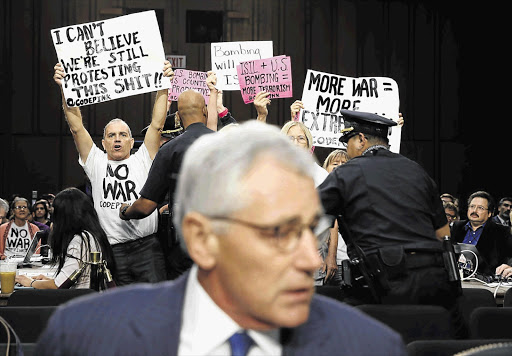 BETTER BELIEVE IT: US Secretary of Defence Chuck Hagel about to testify yesterday at a Senate Armed Services Committee hearing on the threat posed by Islamic State