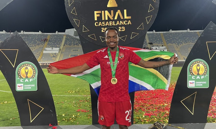 Percy Tau poses after winning his second Caf Champions League winners' medal at Stade Mohamed V in Casablanca after Al Ahly beat Wydad Casablanca to lift the trophy on Sunday night.