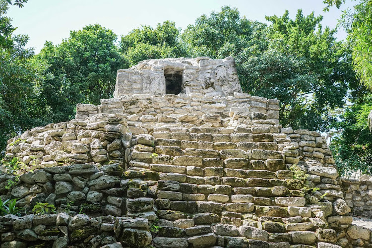 See Maya ruins during a day trip from Cancun, Mexico. 