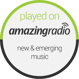 circular disc with gray border containing the text: played on amazingradio