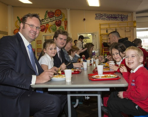 Schoolchildren enjoy their free school meal with Chester MP Stephen Mosley