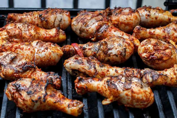 Grilled Chicken Drumsticks with Garlic-Harissa Marinade