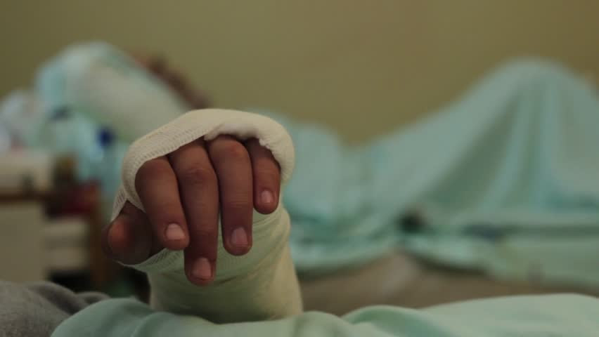 Patient s Hand Drips Blood As He Is Rolled Down Hospital Patient s Hand Drips Blood As He Is Rolled Down Hospital
