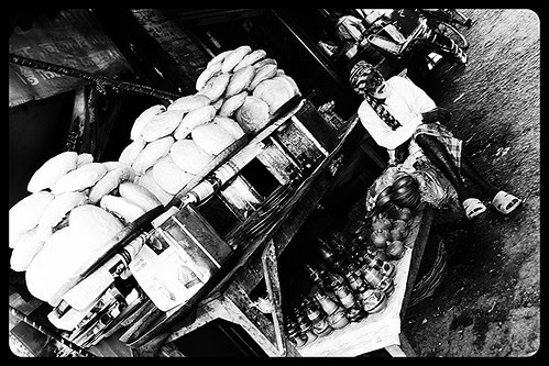 He Tries  To Sell Everything Under The Sun At Dewa Sharif.. by firoze shakir photographerno1