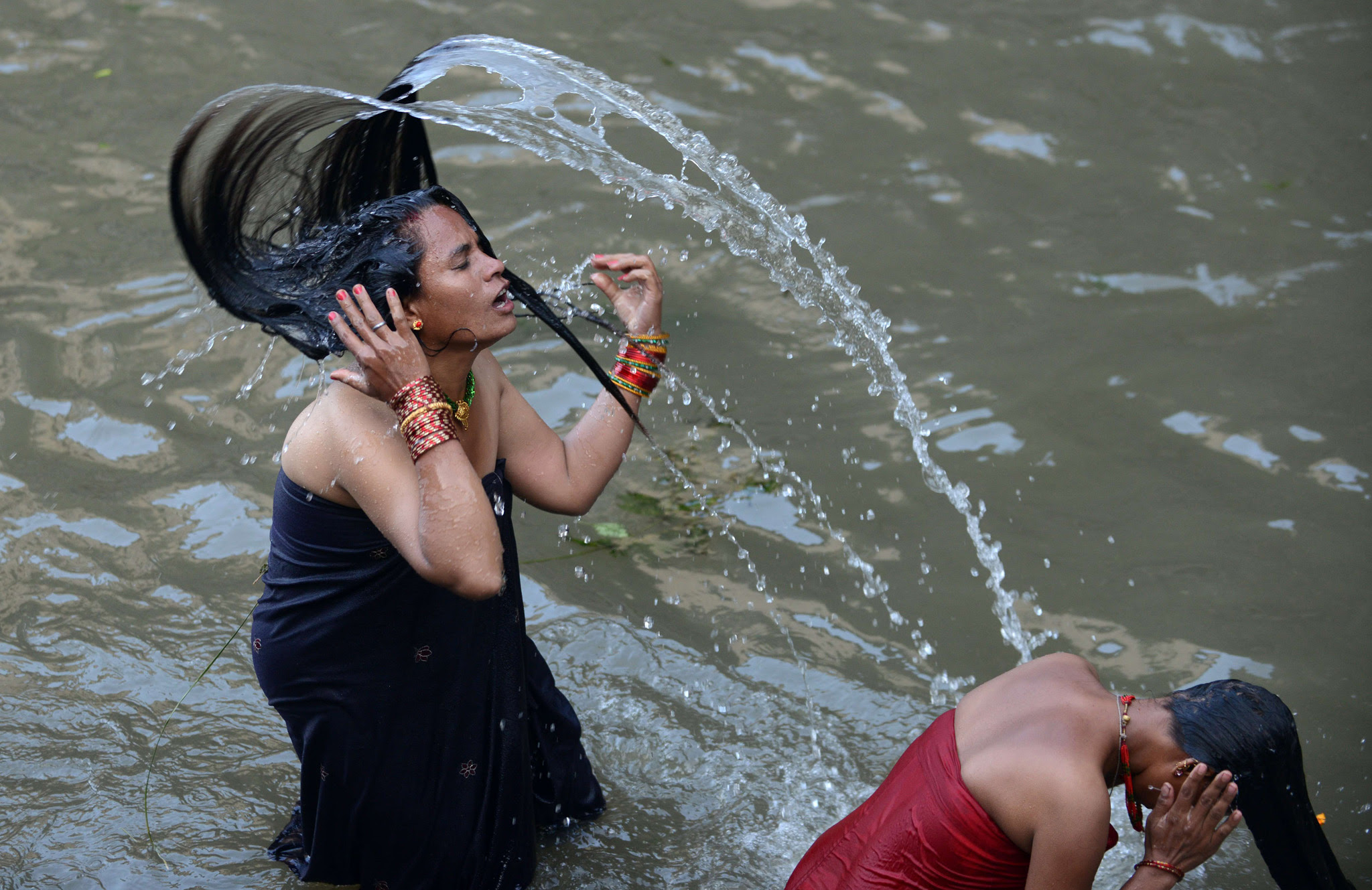 Nepalese Hindu women take a ritual bath in the Bagmati River during the Rishi Panchami festival in Kathmandu. Rishi Panchami marks the end of the three-day long Teej festival, in which married women fast and pray for the good health of their husbands to Shiva, the Hindu god of destruction, while unmarried women wish for handsome husbands and happy conjugal lives.