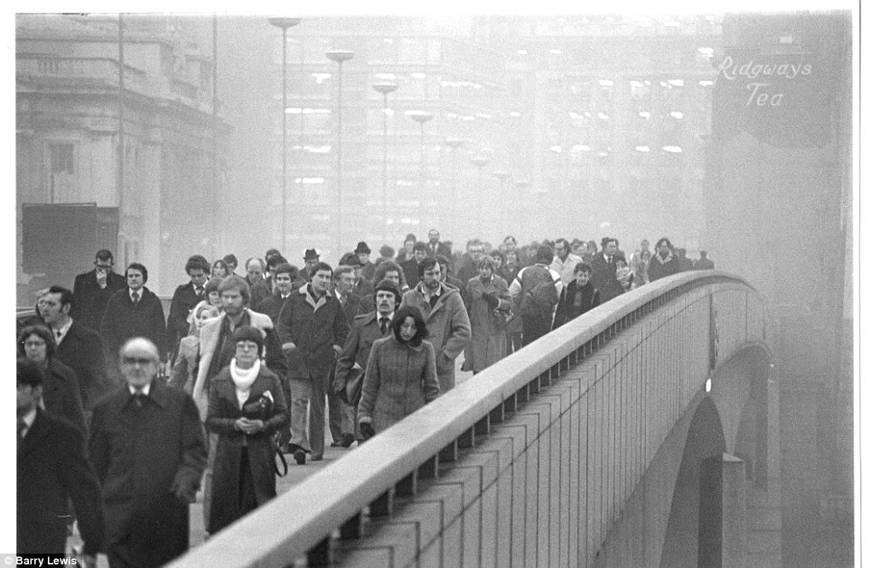 Packed: Commuters flock across the newly rebuilt London Bridge after its grand opening by the Queen in 1973. The current bridge is the fifth version on the site.