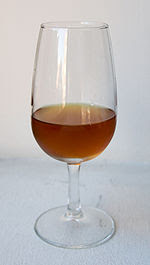 A "copita" sherry glass containing a...