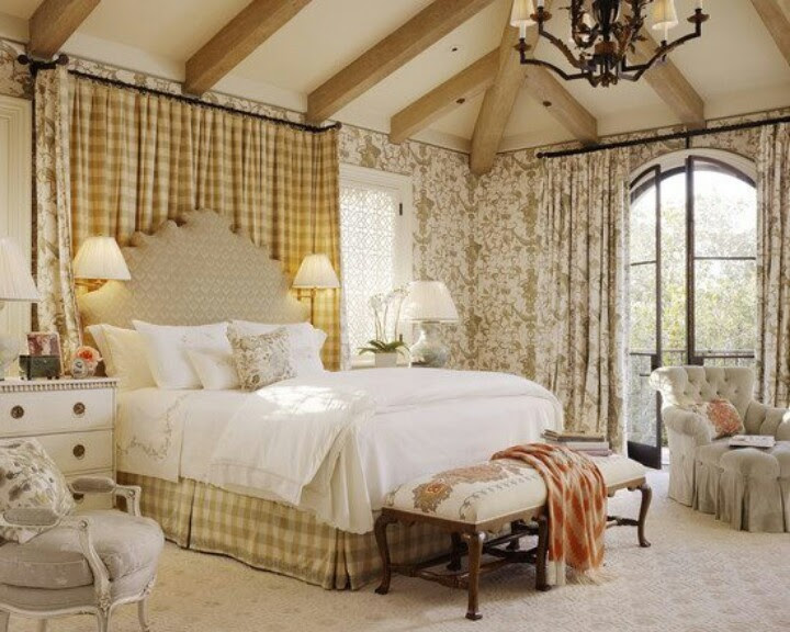 French Country, cheerful feeling created by room, exposed beams on the ceiling, earthy tones, many different patterns, very feminine, painted wood