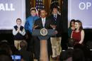 FILE - In this Feb. 28, 2014, file photo, President Barack Obama speaks at the first White House Student Film Festival in the East Room at the White House in Washington. Student filmmakers pictured, Miles Pilchik, left, and Gabrielle Nafie, second right, second graders, SciTech in New York, Kids; Kyle Weintraub, second left, seventh grade, from David Posnack Jewish Day School in Davie, Fla.; and Shelly Ortiz, high school senior at Metropolitan Arts Institute, from Phoenix, Ariz. Obama hosts the second annual student film festival on Friday, March 20, 2015. (AP Photo/Charles Dharapak, File)