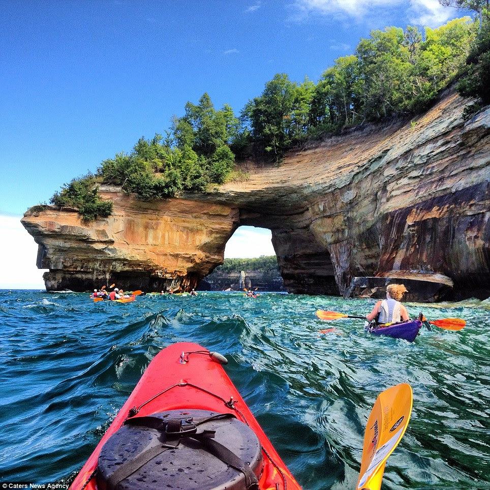 Winning photo: Courtney Kotewa captured this shot of a family kayak along the Pictured Rocks National Lakeshore in northern Michigan using her mobile phone
