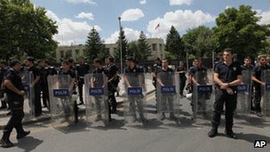 Riot police stand guard outside the US embassy in Ankara, Turkey on 27 July 2013 