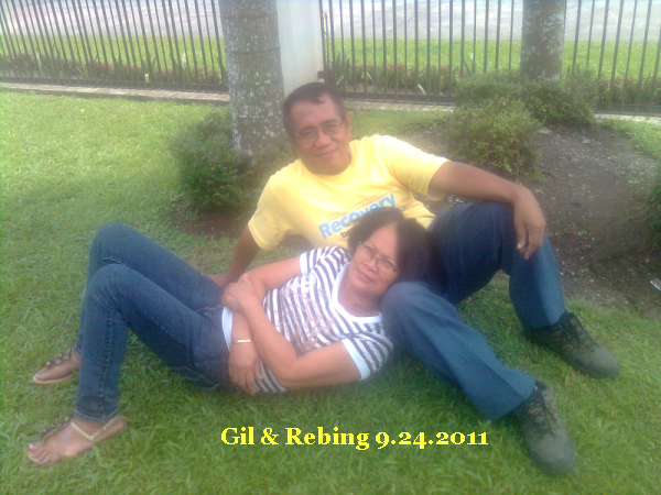 Rebing and me lying on the ground of our Church after the program of Family Week celebration.