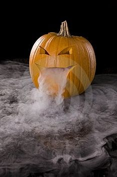 Dry ice inside a pumpkin. Add a green glowstick to make it even eerier.