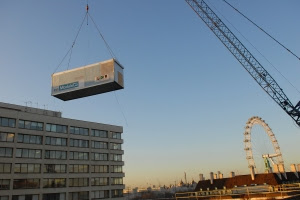 The operating theatre being craned high over an intervening 7 storey building