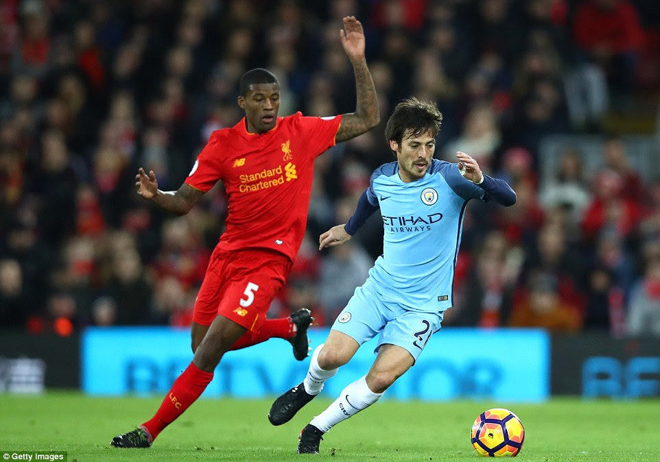 Wijnaldum pays close attention to tricky City midfielder David Silva as the visitors try to battle back into the game