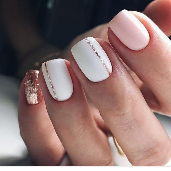 So Cute Short Acrylic Nails Ideas, You Will Love Them! One accent nail has silver sparkles and the the short nails featured here are a vibrant pink shade.