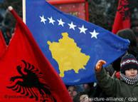Kosovo Albanians celebrate independence, waving Albanian natioanl flag and Kosovo's flag